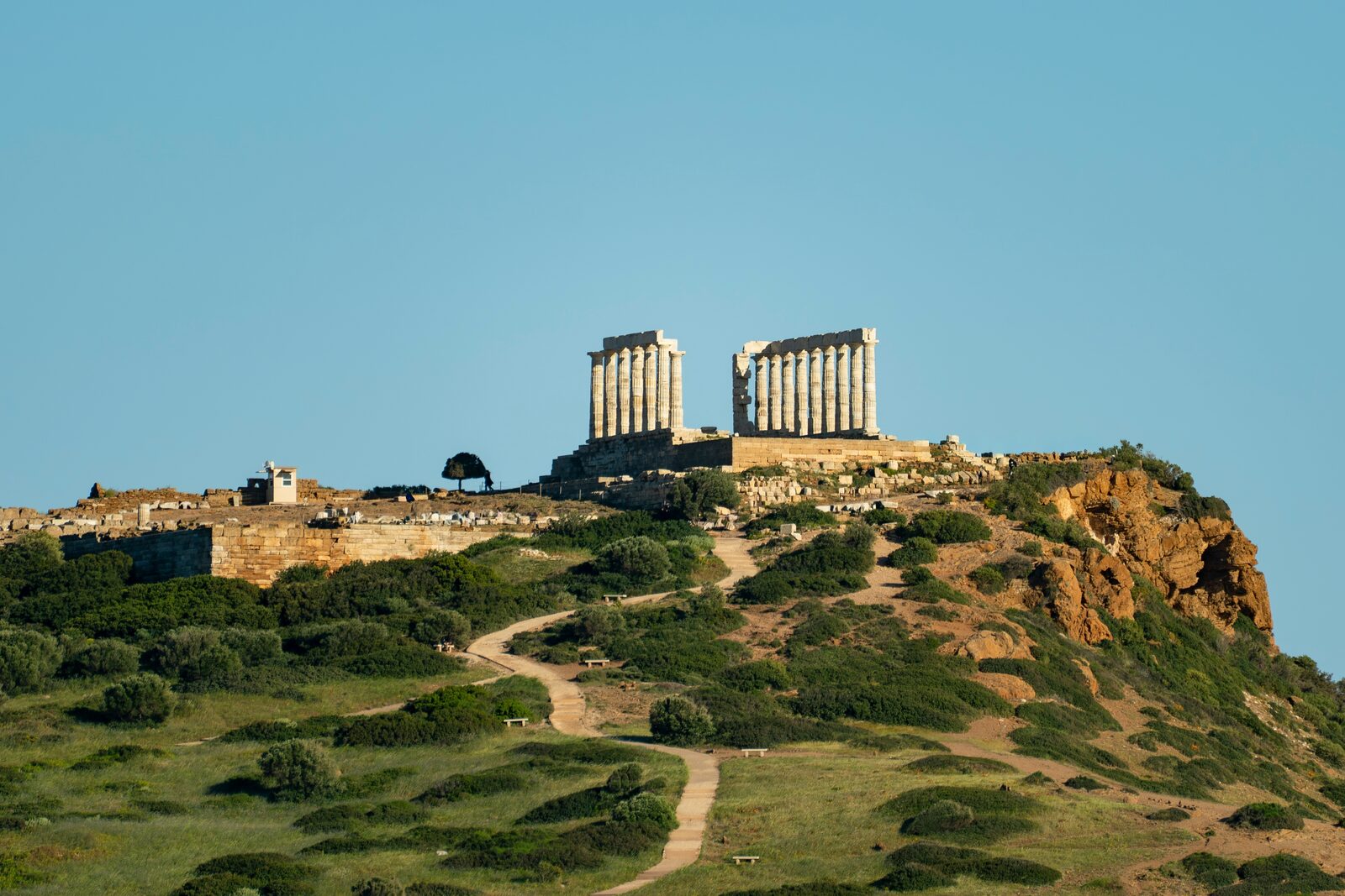 The Temple of Poseidon at Cape Sounion above the Aegean Sea at sunset
