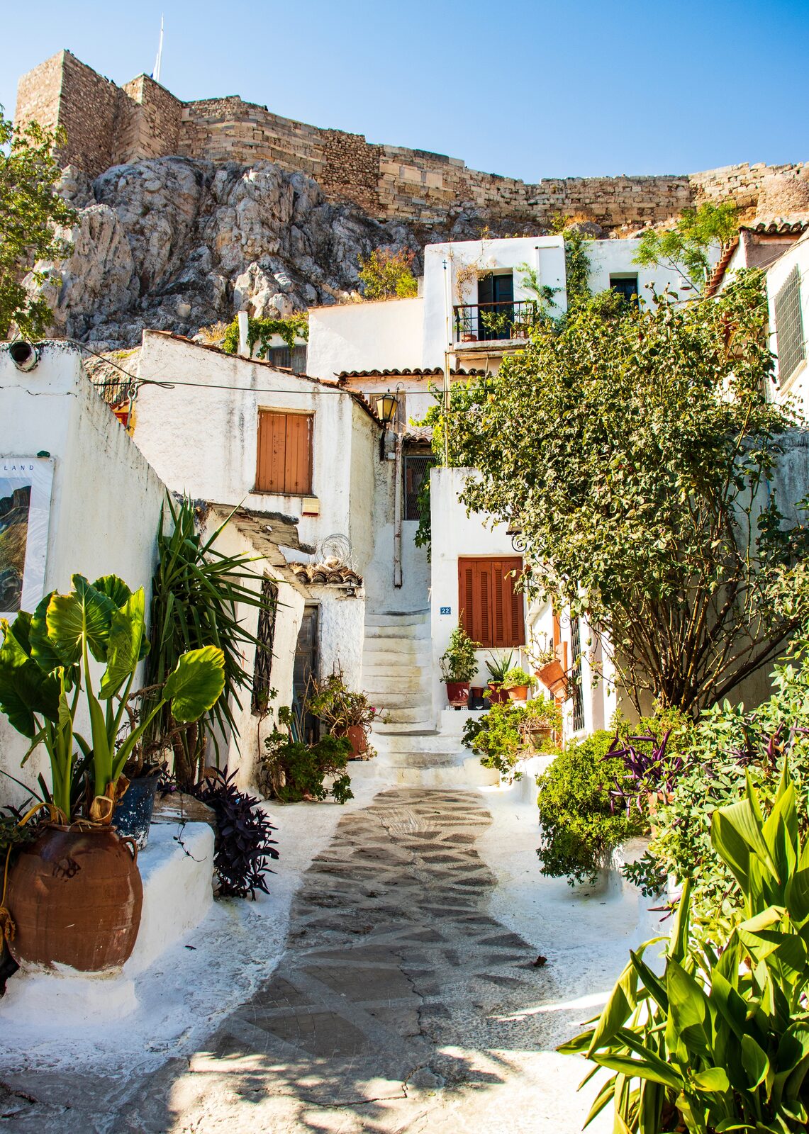 A whitewashed stepped lane with bougainvillea in the Plaka district of Athens