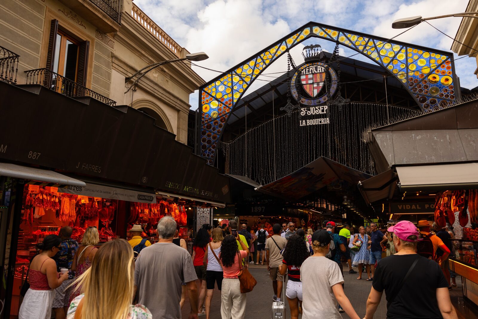 Fresh produce and food stalls at La Boqueria Market in Barcelona