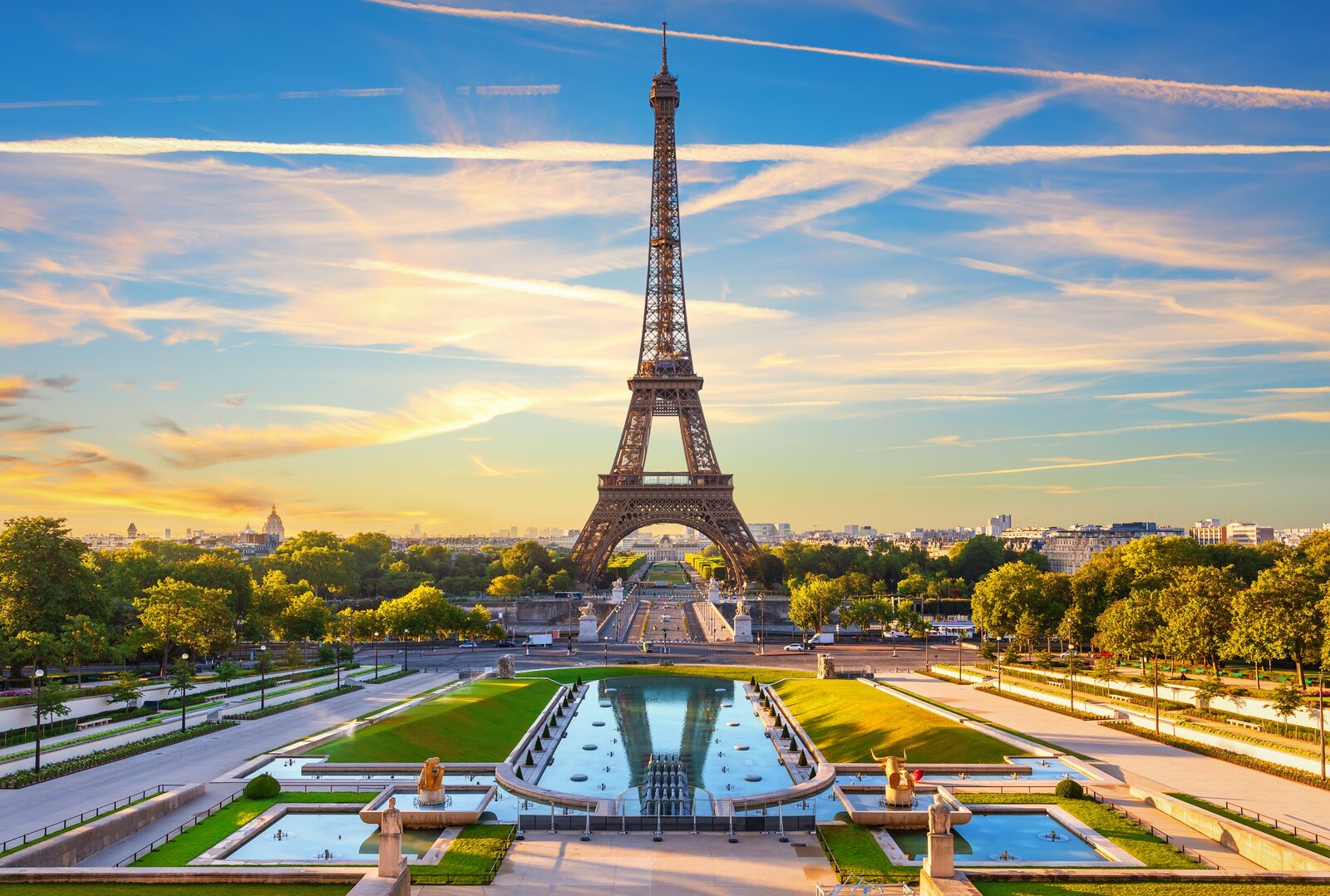 The Eiffel Tower rising above Paris at dusk