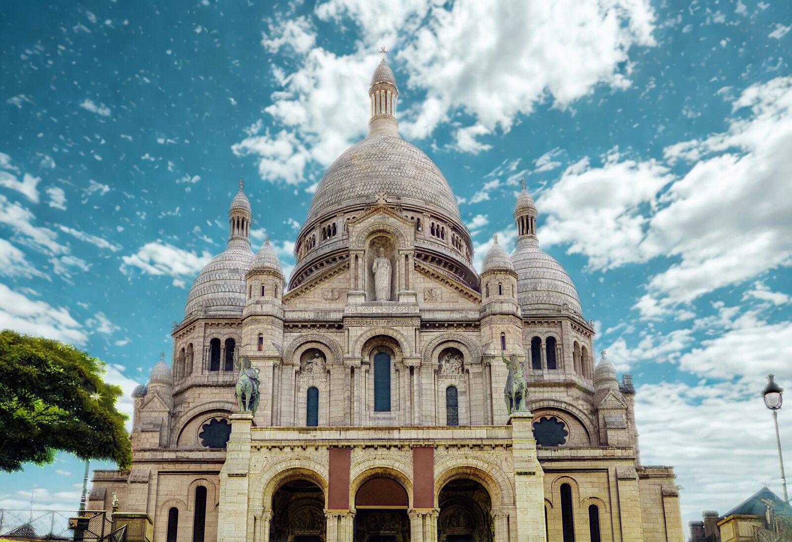 The white Basilica of Sacré-Cœur atop Montmartre hill in Paris