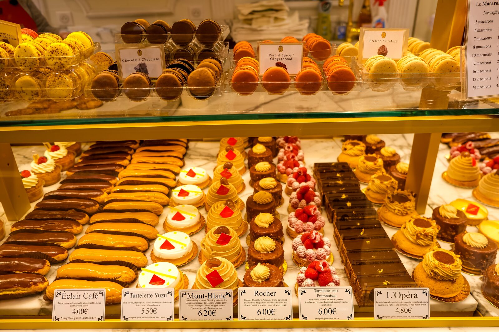 A Paris patisserie display of macarons and croissants