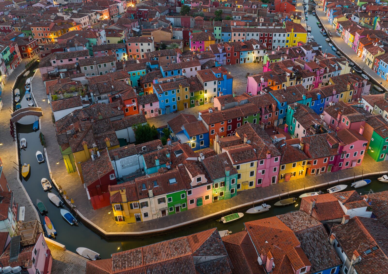 Brightly painted houses along a canal on the island of Burano near Venice