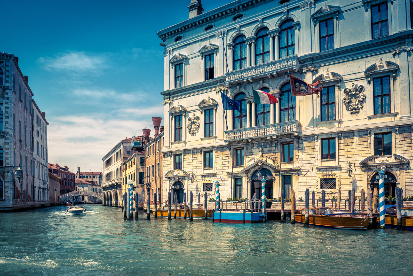 A luxury hotel terrace overlooking a canal in Venice
