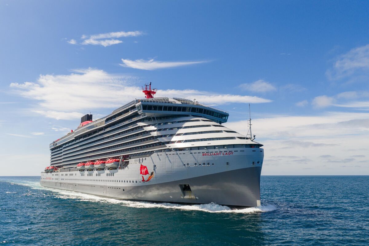 Virgin Voyages Brilliant Lady sails across open blue water under a bright sky