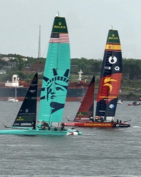 Racing catamarans with tall wing sails speed across Halifax Harbour